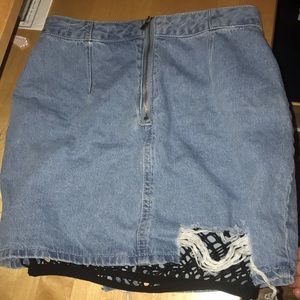 Ripped jean skirt with netting attached